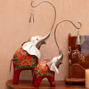 Elephant Pair with Bells on Their Tusks