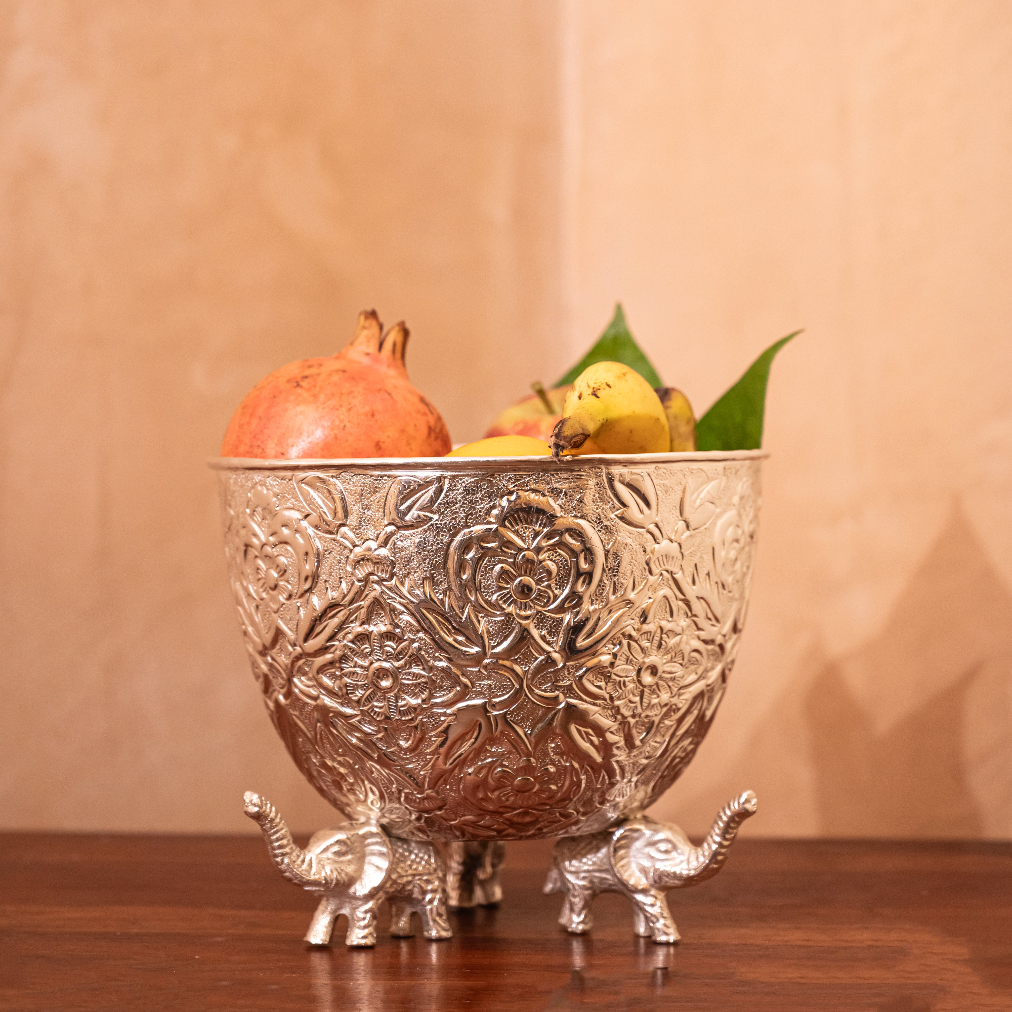 Long Urli Fruit Bowl Supported by Elephant Stands