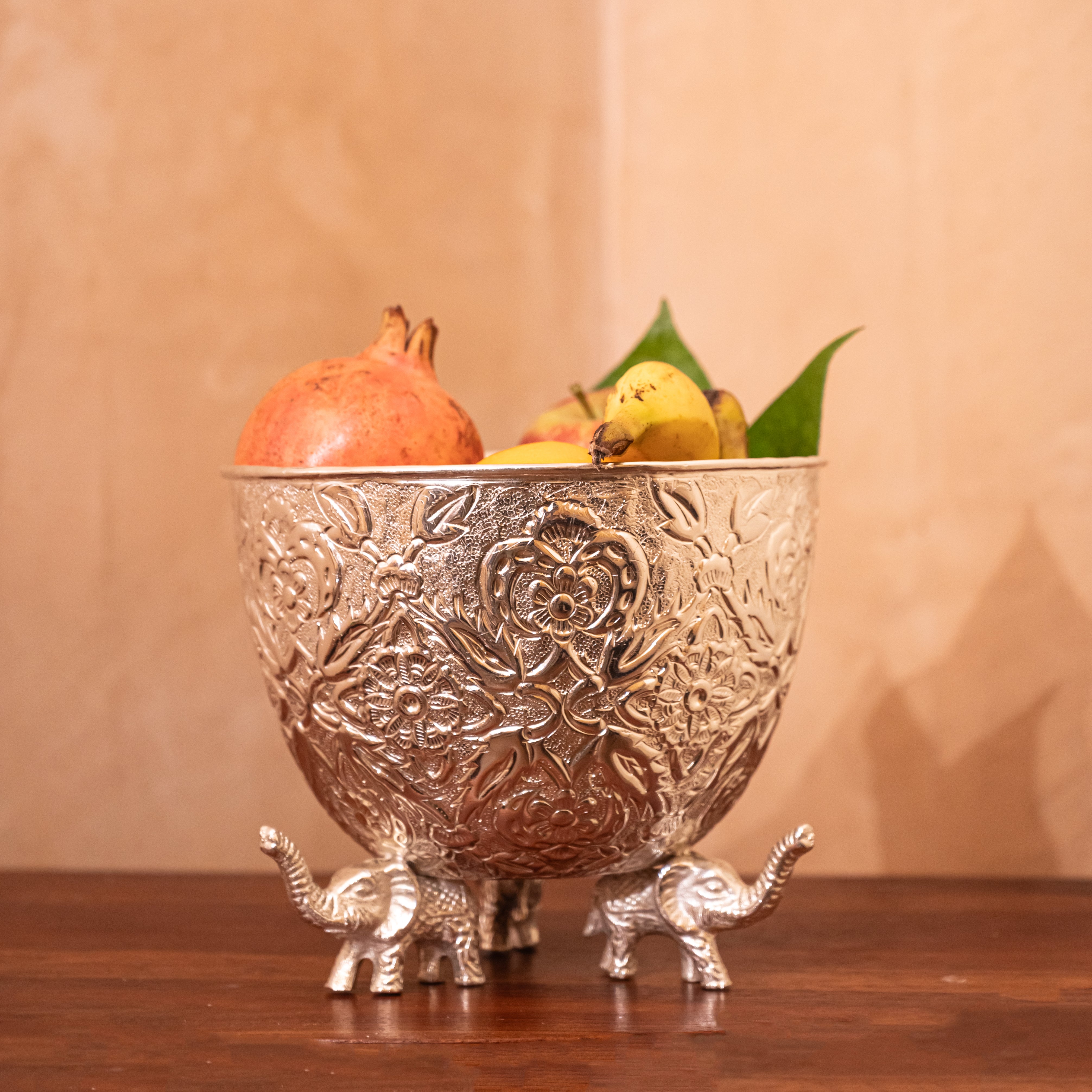 Long Urli Fruit Bowl Supported by Elephant Stands